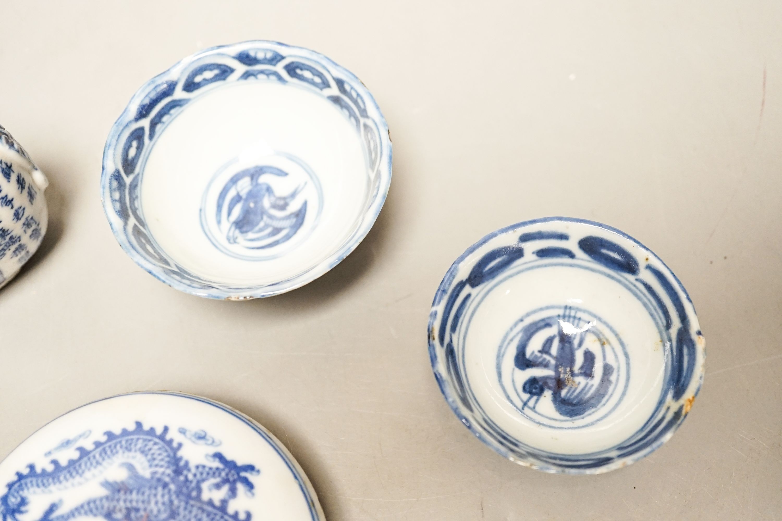 A Chinese underglaze blue and copper red snuff bottle, late 19th century, two blue and white bowls and a box and cover (4) 8.5cm